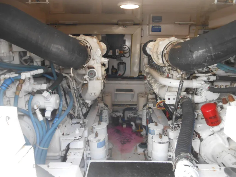 Slide: The Image of Engine room of 2007 Viking Boats 52 Open, showcasing dual engines and mechanical components. - 31