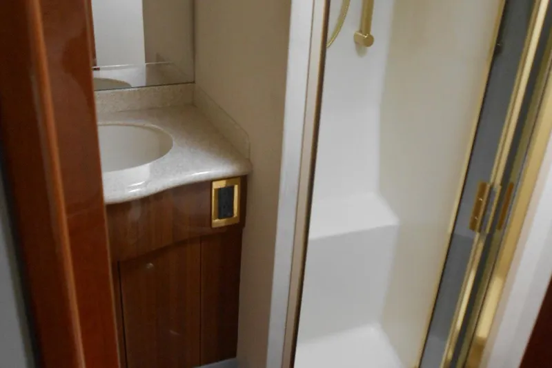 Slide: The Image of Bathroom interior of 2007 Viking Boats 52 Open with shower and vanity. - 34