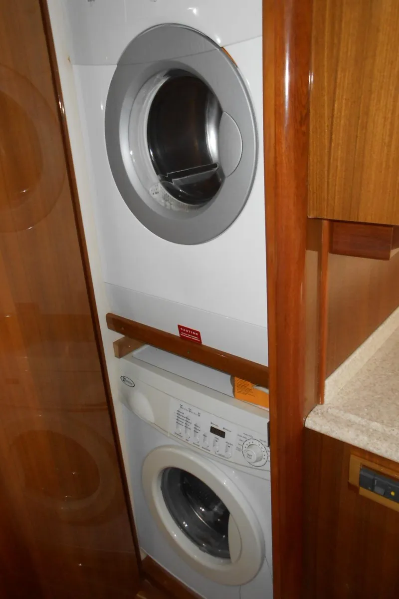 Slide: The Image of Stacked washer and dryer in 2007 Viking Boats 52 Open yacht interior. - 37