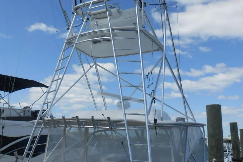 Slide: The Image of 2007 Viking Boats 52 Open with tower against a blue sky background. - 38