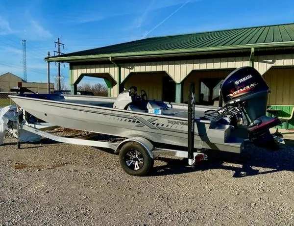 The Image of 2023 Xpress XP185 Catfish boat with Yamaha engine on trailer, parked outdoors. - 1