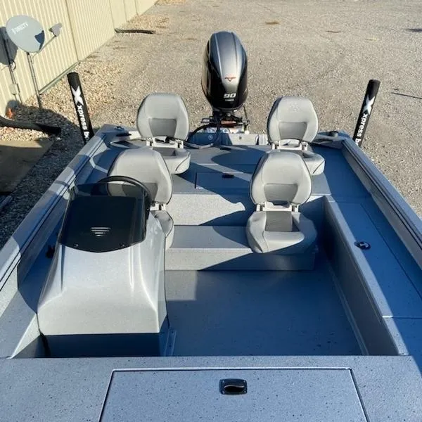 Slide: The Image of 2023 Xpress XP185 Catfish boat with four seats and a 90 HP outboard motor. - 3