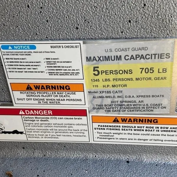 Slide: The Image of Safety labels on 2023 Xpress XP185 Catfish boat, detailing capacity and warnings. - 9