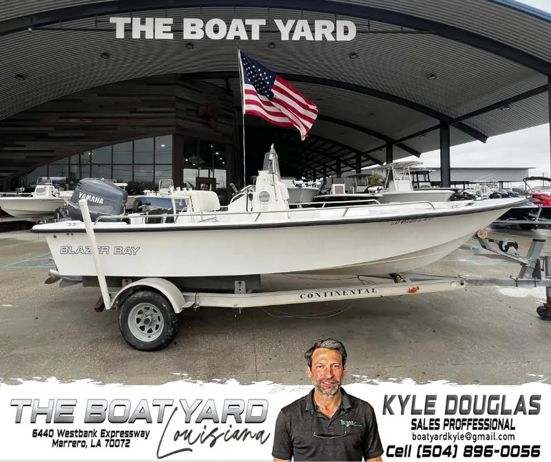 Slide: The Image of Blazer 1860 boat at The Boat Yard, Marrero, Louisiana, with American flag and sales contact details. - 1