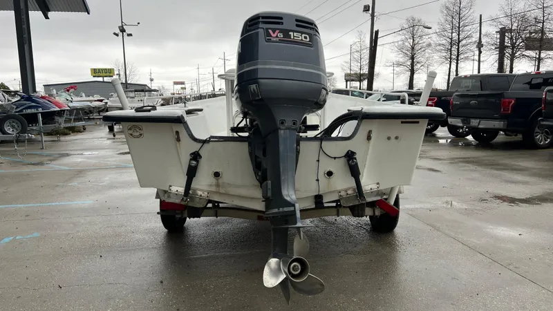 Slide: The Image of Rear view of a 2000 Blazer 1860 boat with V6 150 outboard motor. - 4