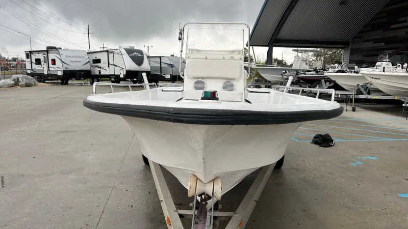 Slide: The Image of Front view of a 2000 Blazer 1860 boat on a trailer in a parking lot. - 5