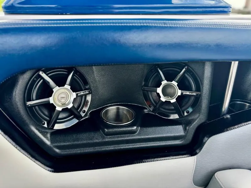 Slide: The Image of 2011 Nautique 200V boat interior with Polk Audio speakers and cup holder. - 11