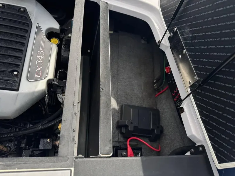 Slide: The Image of Engine compartment of a 2011 Nautique 200V boat, featuring an EX343 engine. - 4