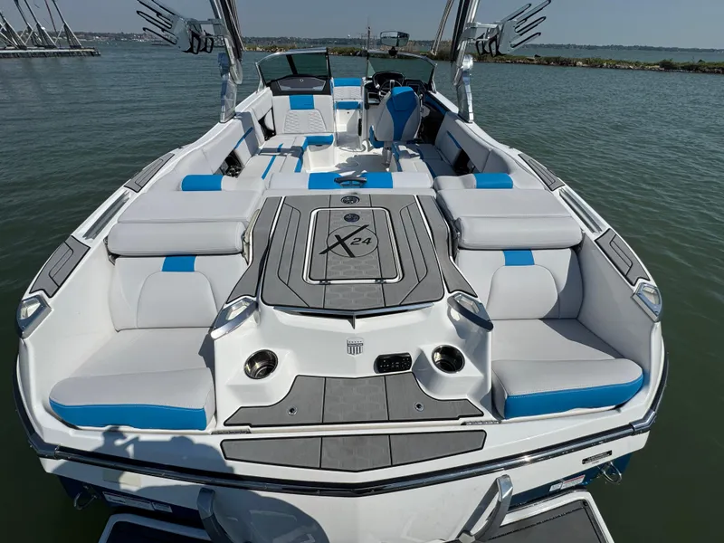 Slide: The Image of 2019 MasterCraft X24 boat with spacious seating and modern design on the water. - 25