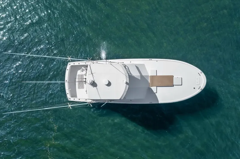Slide: The Image of Aerial view of 1978 Hatteras 45 Convertible yacht on clear blue water. - 17