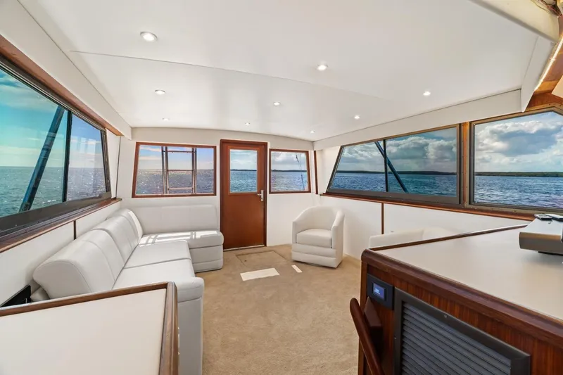 Slide: The Image of Interior of 1978 Hatteras 45 Convertible yacht with panoramic ocean views. - 28