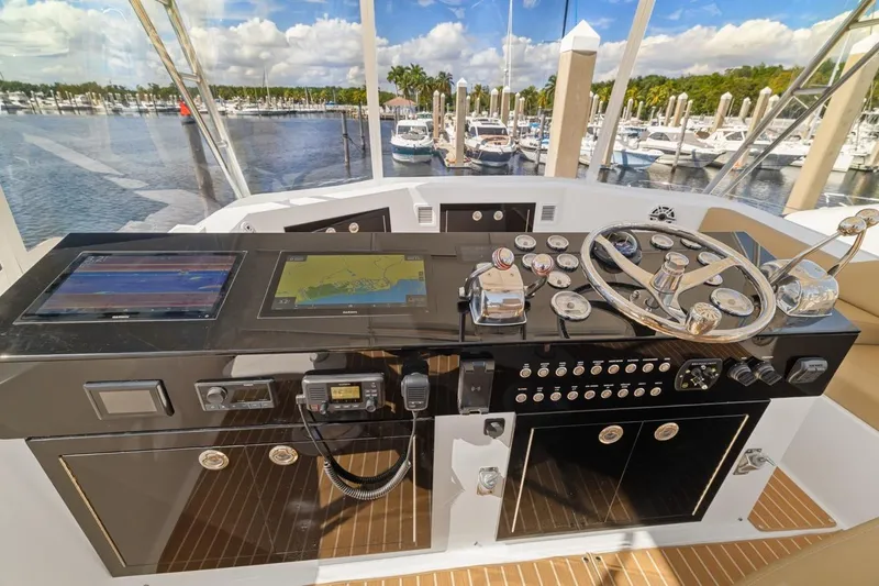 Slide: The Image of Cockpit of 1978 Hatteras 45 Convertible yacht with navigation equipment and steering wheel. - 46