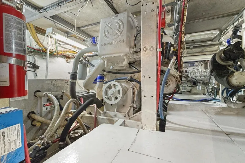 Slide: The Image of Engine room of a 1978 Hatteras 45 Convertible yacht, showcasing mechanical components. - 60