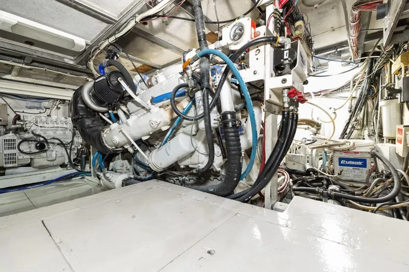 Slide: The Image of Engine room of a 1978 Hatteras 45 Convertible yacht, showcasing mechanical components. - 61