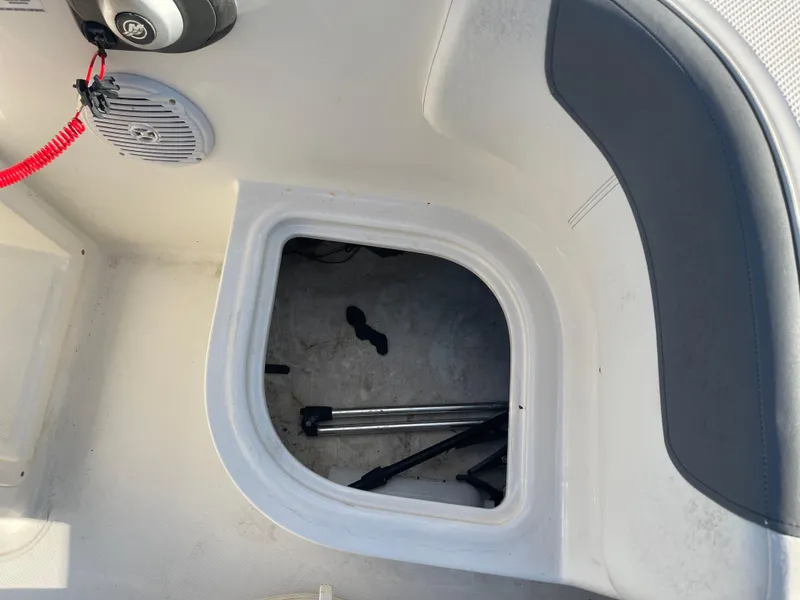Slide: The Image of Storage compartment in a 2017 Bayliner Element E16 boat interior. - 19