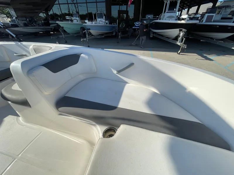 Slide: The Image of 2017 Bayliner Element E16 boat interior with seating area, displayed outdoors. - 8