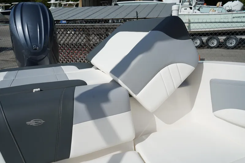 Slide: The Image of 2023 Chaparral 21 SSi OB boat interior with gray and white seating. - 10