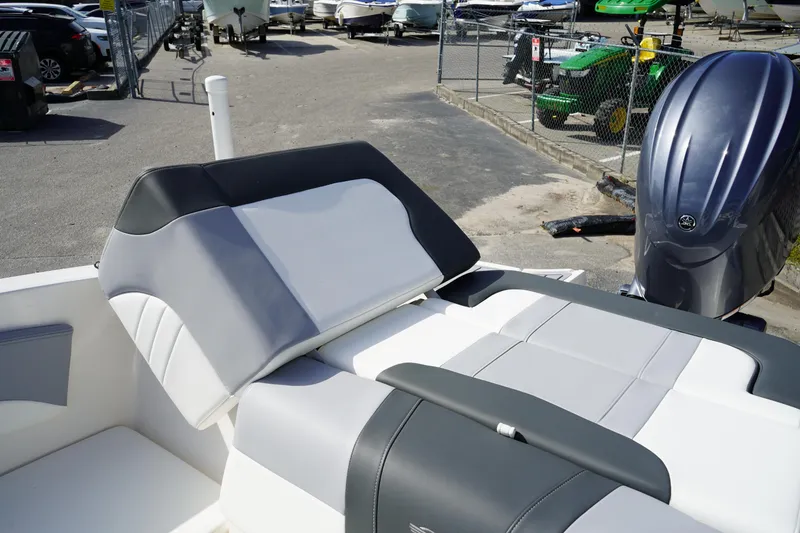 Slide: The Image of 2023 Chaparral 21 SSi OB boat interior with gray and white seating. - 15