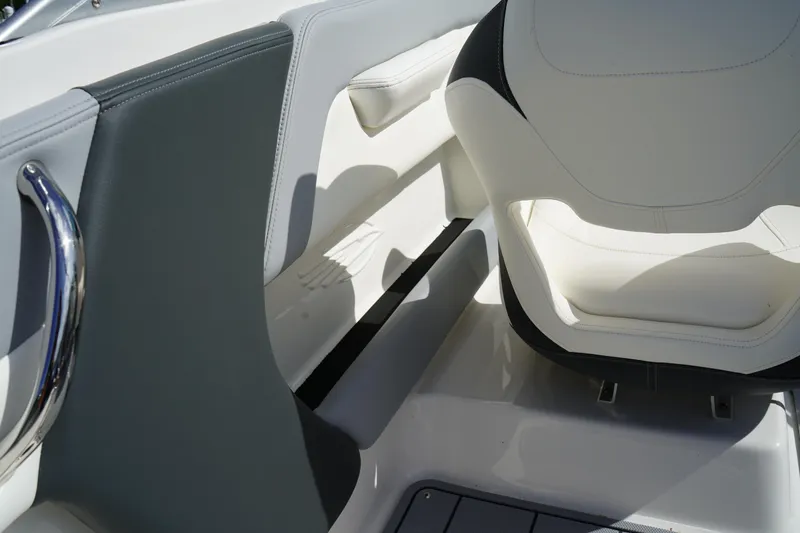 Slide: The Image of 2023 Chaparral 21 SSi OB boat interior with white and gray seating. - 18