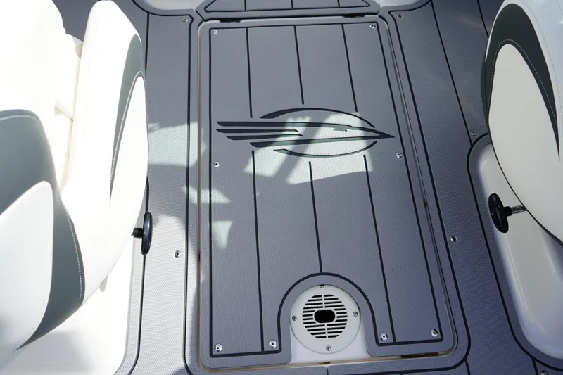 Slide: The Image of 2023 Chaparral 21 SSi OB boat interior with sleek gray flooring and stylish seating. - 23