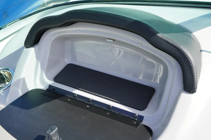 Slide: The Image of 2023 Chaparral 21 SSi OB boat dashboard storage compartment, open and empty. - 26