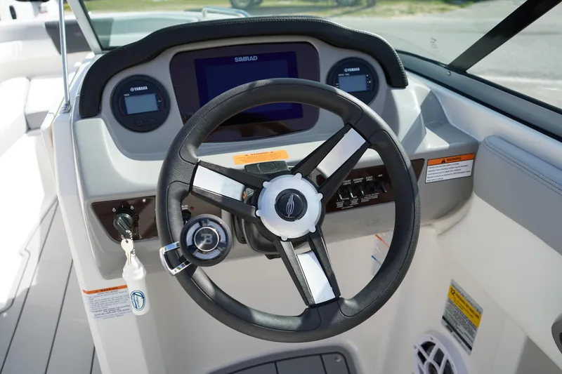 Slide: The Image of Steering wheel and dashboard of 2023 Chaparral 21 SSi OB boat. - 27