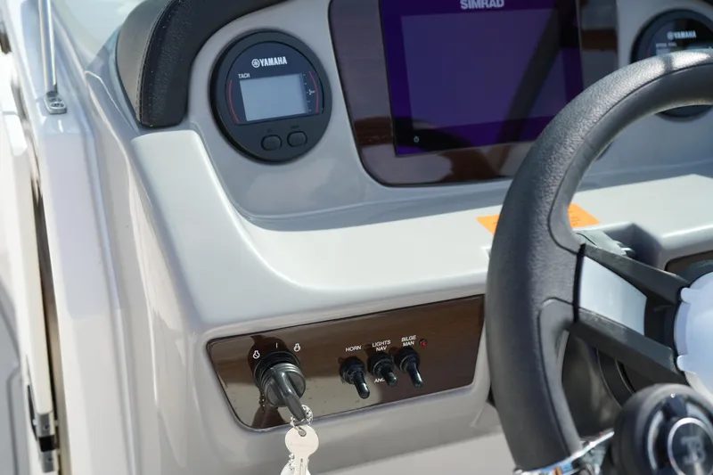 Slide: The Image of Dashboard of 2023 Chaparral 21 SSi OB boat with Yamaha and Simrad displays. - 29