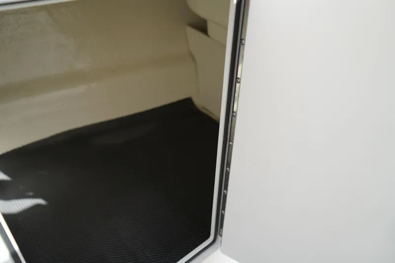 Slide: The Image of Interior storage compartment of 2023 Chaparral 21 SSi OB boat. - 33
