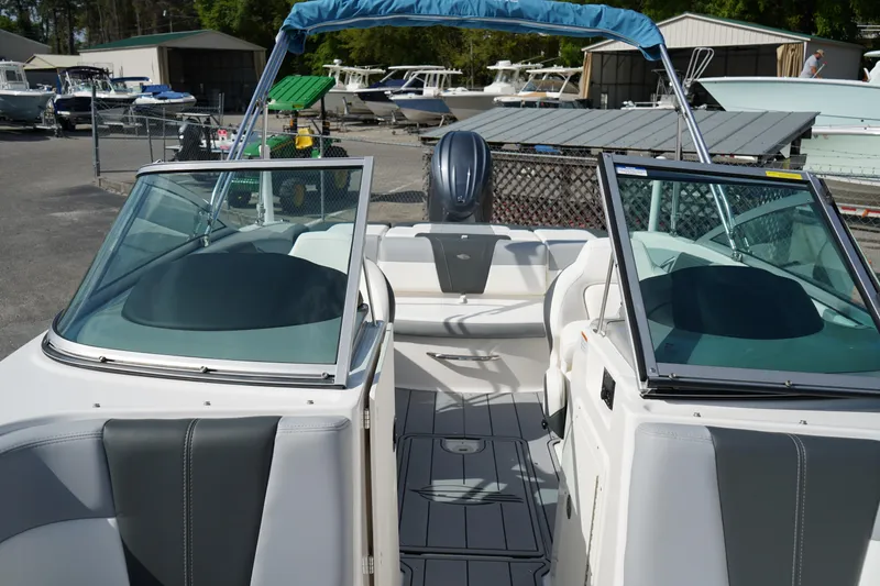 Slide: The Image of 2023 Chaparral 21 SSi OB boat interior with open deck and seating. - 35