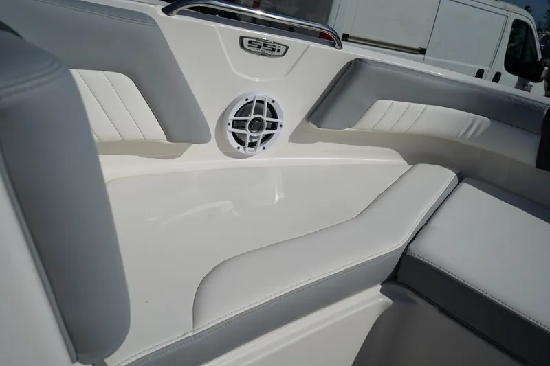 Slide: The Image of Interior of 2023 Chaparral 21 SSi OB boat with cushioned seating and speaker. - 38
