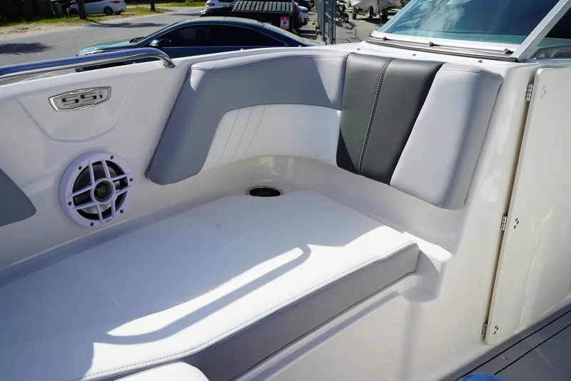 Slide: The Image of 2023 Chaparral 21 SSi OB boat interior with cushioned seating and speaker. - 40