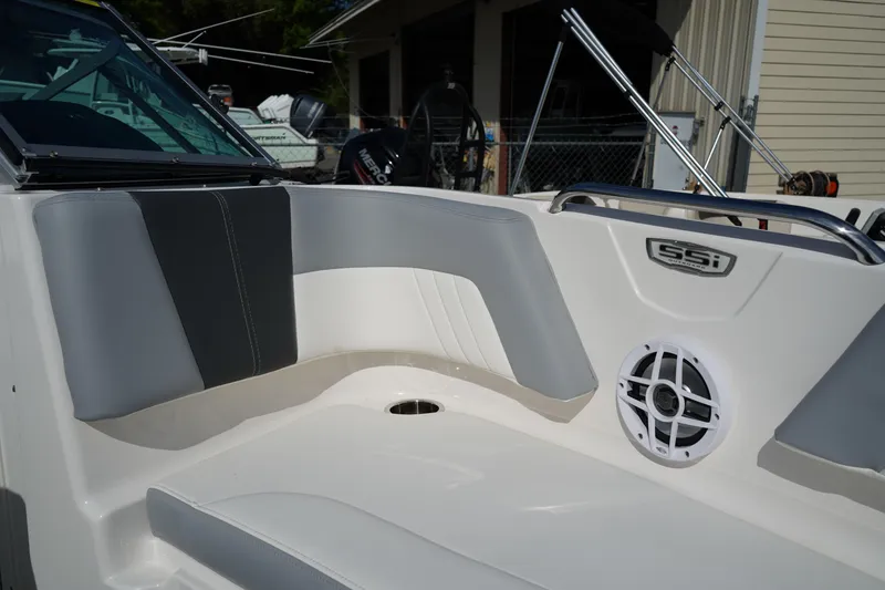Slide: The Image of 2023 Chaparral 21 SSi OB boat interior with gray seating and speaker. - 41