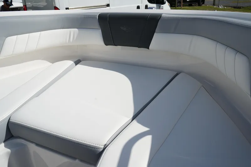 Slide: The Image of 2023 Chaparral 21 SSi OB boat interior with white cushioned seating. - 42