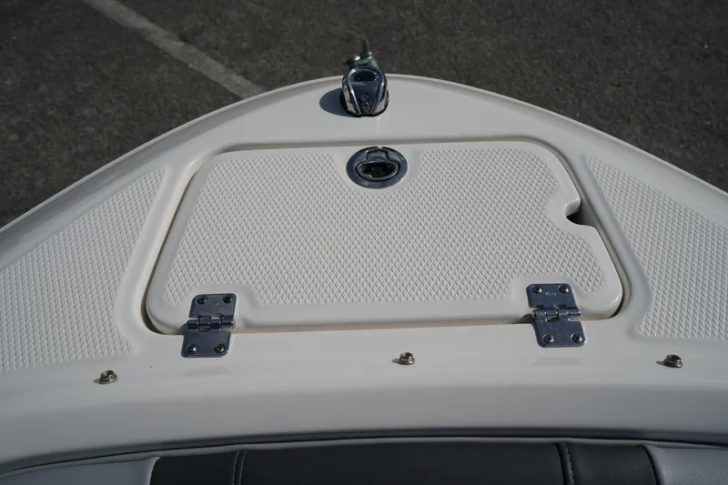 Slide: The Image of 2023 Chaparral 21 SSi OB boat bow with storage compartment and latch. - 43