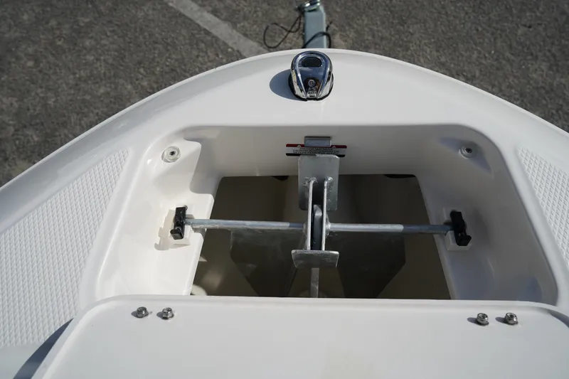 Slide: The Image of 2023 Chaparral 21 SSi OB boat anchor compartment, featuring a sleek, modern design. - 44