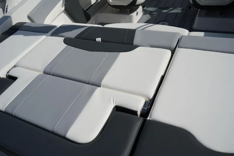 Slide: The Image of 2023 Chaparral 21 SSi OB boat interior with sleek, modern seating design. - 9