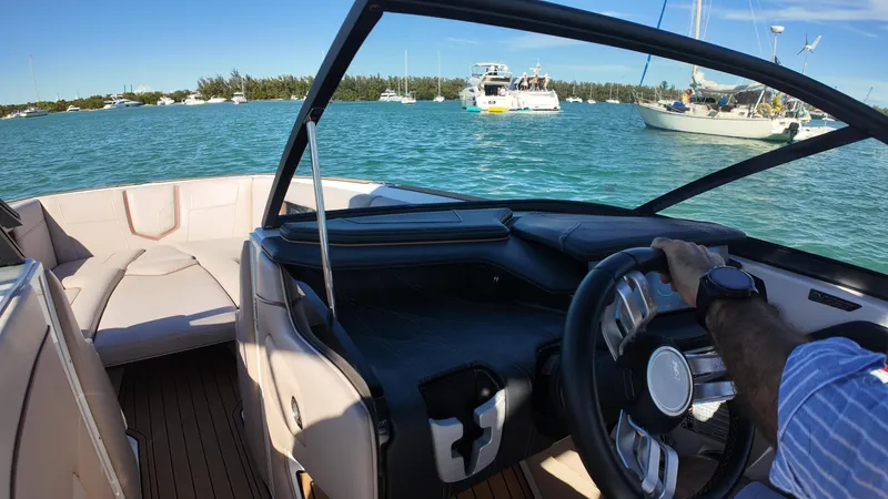 Slide: The Image of 2018 Nautique Super Air Nautique G25 on water, interior view with steering wheel. - 29