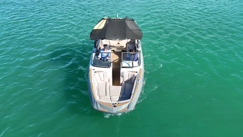 Slide: The Image of 2018 Nautique Super Air Nautique G25 boat on clear turquoise water. - 3