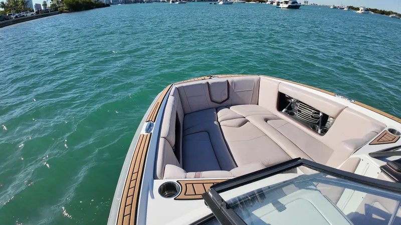 Slide: The Image of 2018 Nautique Super Air Nautique G25 boat interior on calm water. - 48