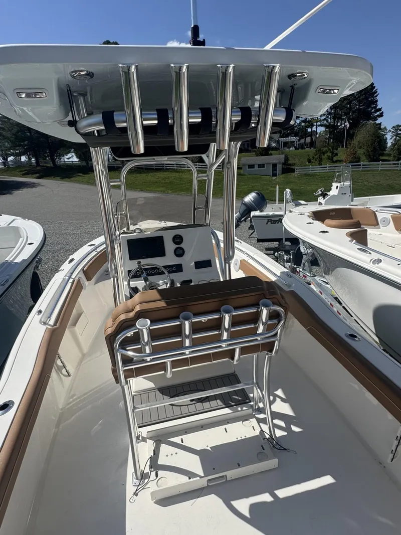 Slide: The Image of 2025 Key West 239 FS boat interior with modern console and seating. - 4