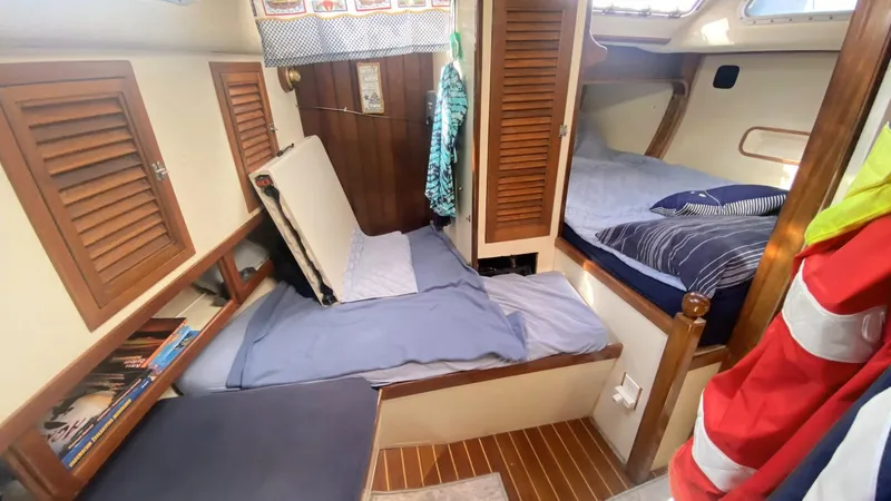 Slide: The Image of Cozy cabin interior of 1990 Bruce Roberts 43 Mauritius sailboat with wooden accents. - 6
