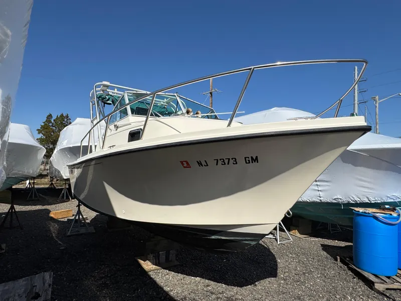 Slide: The Image of 2000 Parker 2110 Walkaround boat on dry dock, side view. - 2