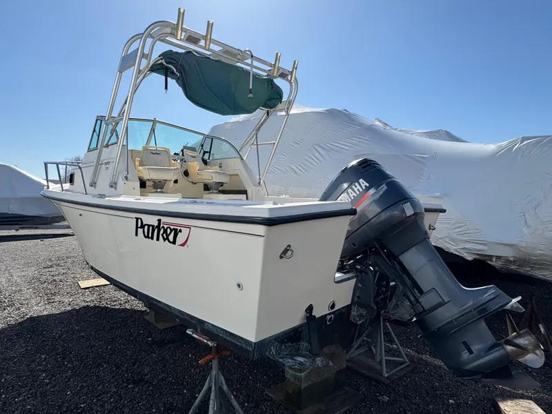 Slide: The Image of 2000 Parker 2110 Walkaround boat with Yamaha outboard motor on a sunny day. - 4