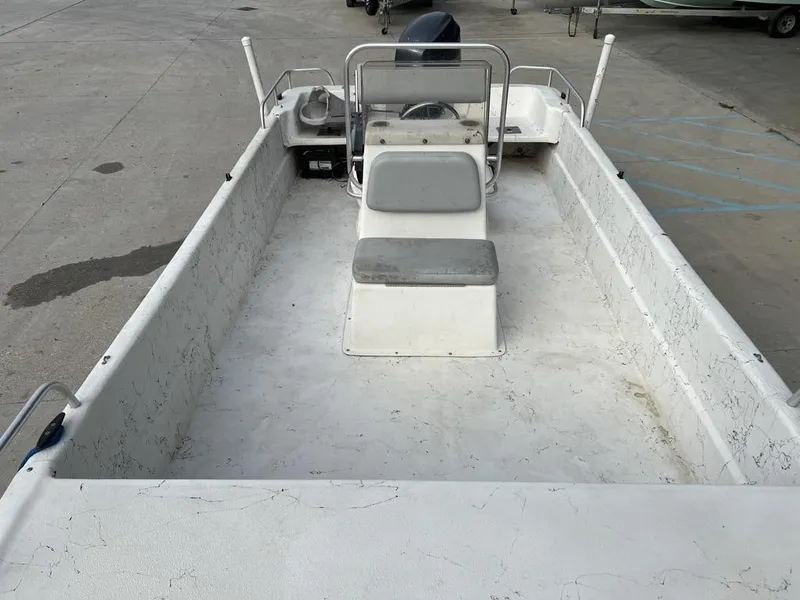 Slide: The Image of 2007 Carolina Skiff 198 DLX boat interior with seating and steering console. - 10