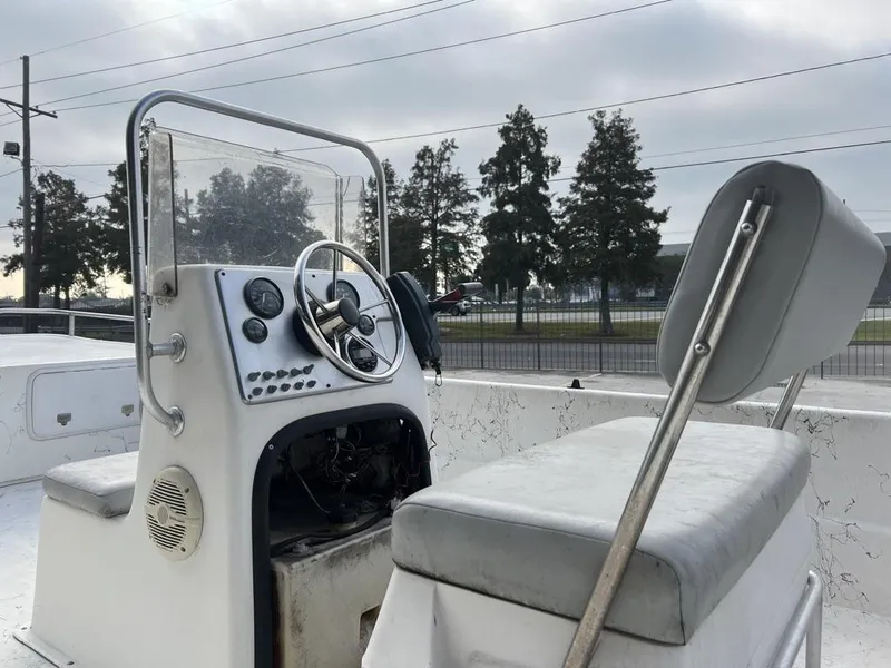 Slide: The Image of 2007 Carolina Skiff 198 DLX boat interior with steering console and seating. - 12