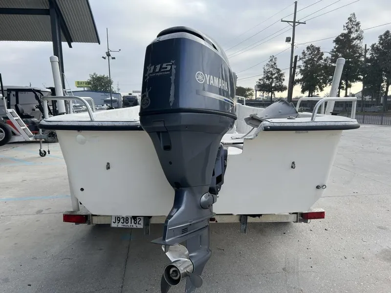 Slide: The Image of 2007 Carolina Skiff 198 DLX with Yamaha 115 outboard motor, parked on a trailer. - 13