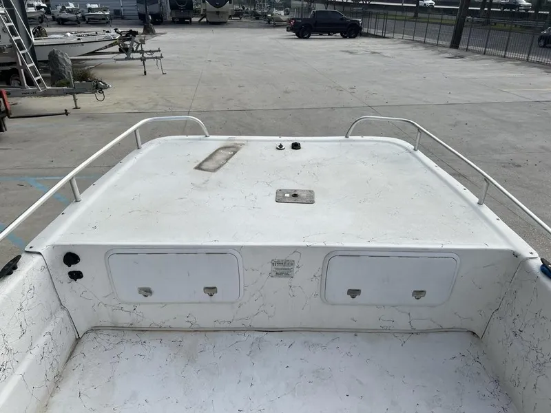 Slide: The Image of 2007 Carolina Skiff 198 DLX boat deck in a parking lot. - 3