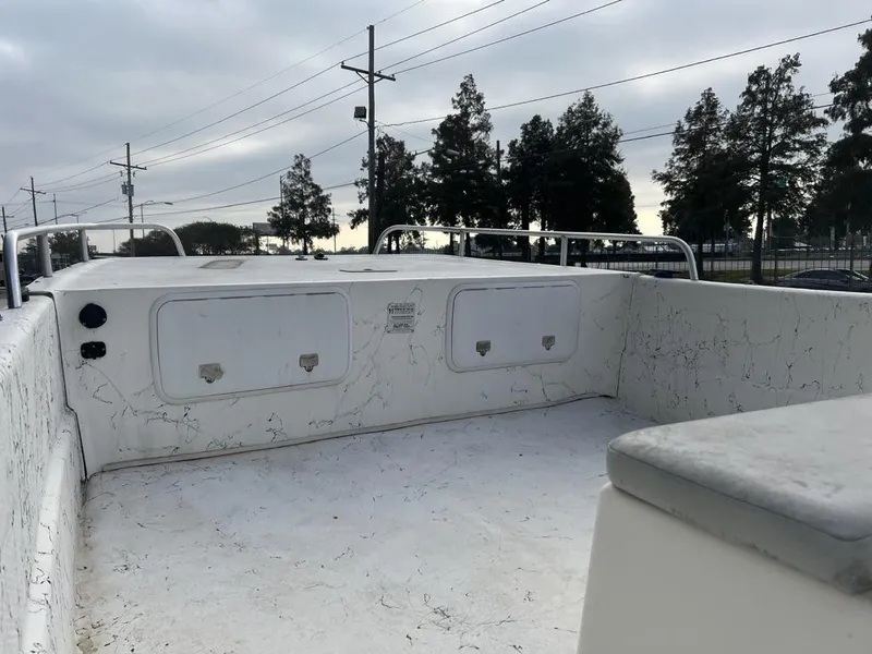 Slide: The Image of 2007 Carolina Skiff 198 DLX boat interior with storage compartments and railings. - 6