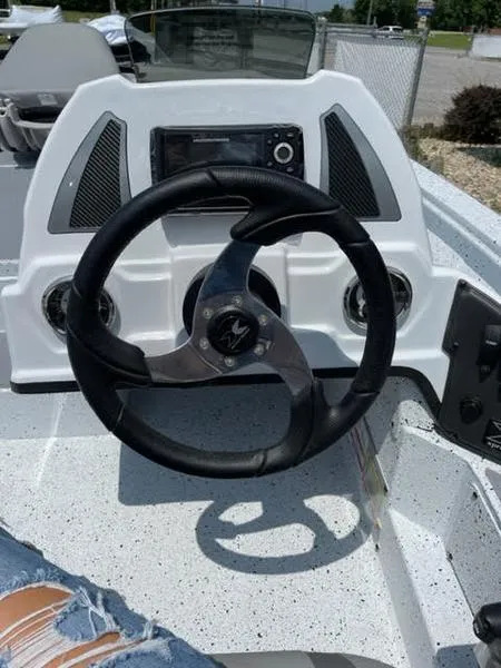 Slide: The Image of 2023 Xpress H17 boat dashboard with steering wheel and control panel. - 6