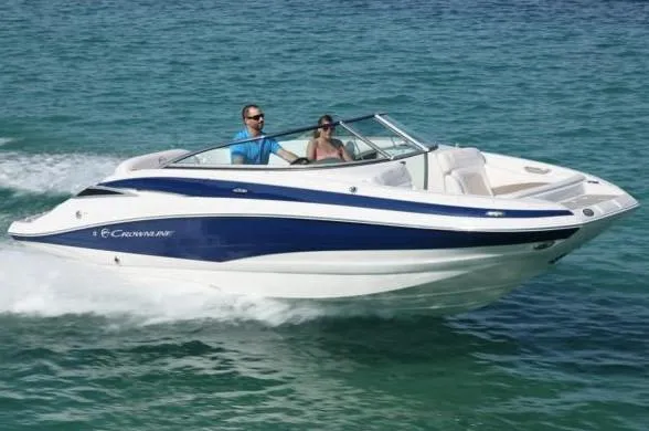 Slide: The Image of 2012 Crownline Eclipse E2 boat cruising on clear blue water. - 15